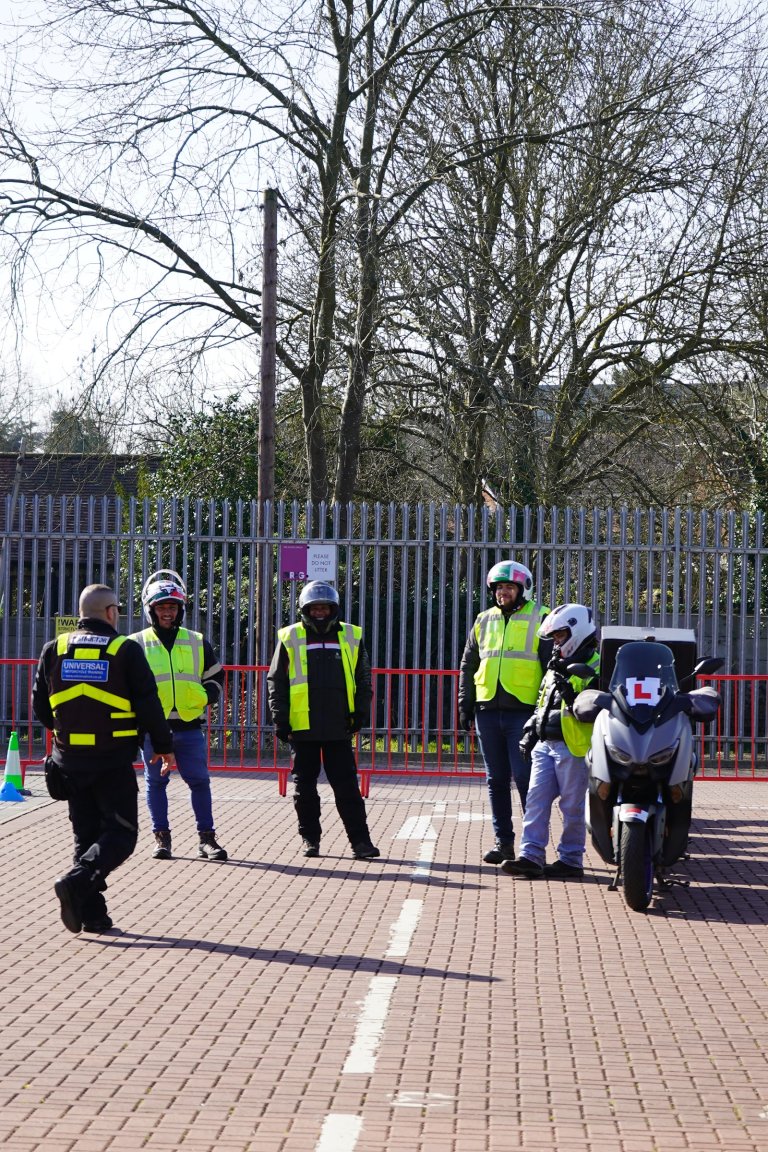 Trainees in hi-vis on the CBT pad at The Hive - Universal Motorcycle Training Edgware centre